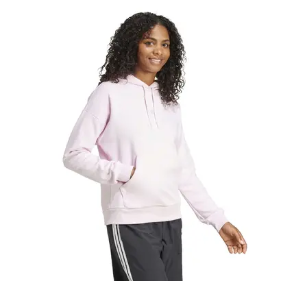 Πλάγια όψη γυναικείου φούτερ με κουκούλα Adidas Essentials Feelcozy Small Logo σε ροζ χρώμα.