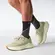 Ανδρικό παπούτσι running Salomon Aero Glide 3 σε χρώμα Green Haze/Vanilla Ice/Russet, μοντέλο σε βηματισμό